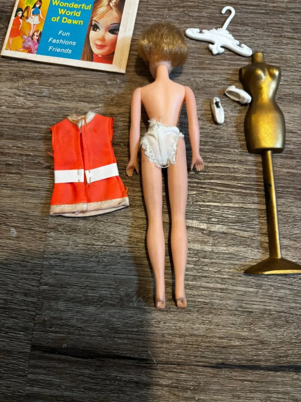 Topper Dawn Jessica doll wearing orange Stewardess uniform